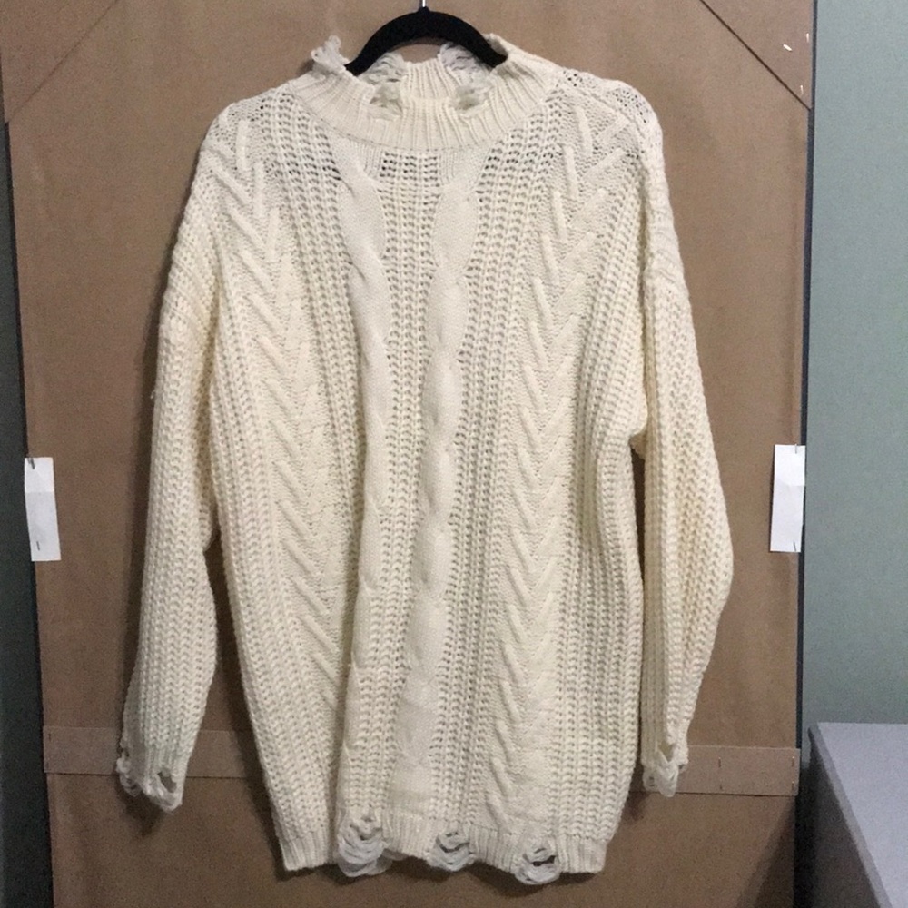 Cream knit sweater with torn details